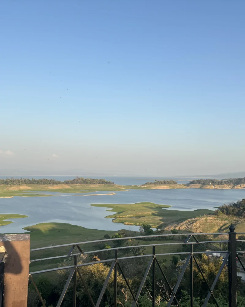 The Pong reservoir seen from the terrace at Lodge at Pong, Dhameta, with grass islands standing above the waterline