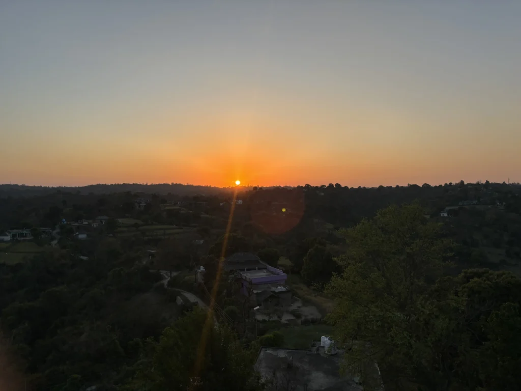 The sun setting behind the Kangra hills, seen from Lodge at Pong, Dhameta