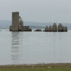 The Bathu ki Ladi temples standing in the water of the Pong Dam reservoir, Kangra