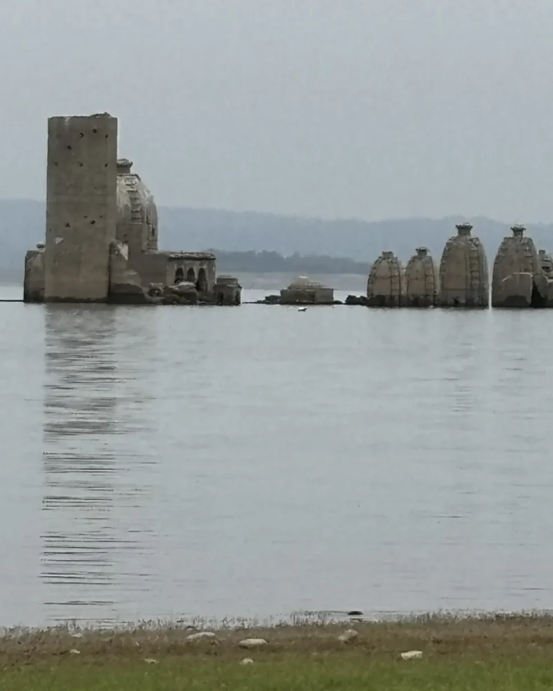 The Bathu ki Ladi temples standing in the water of the Pong Dam reservoir, Kangra